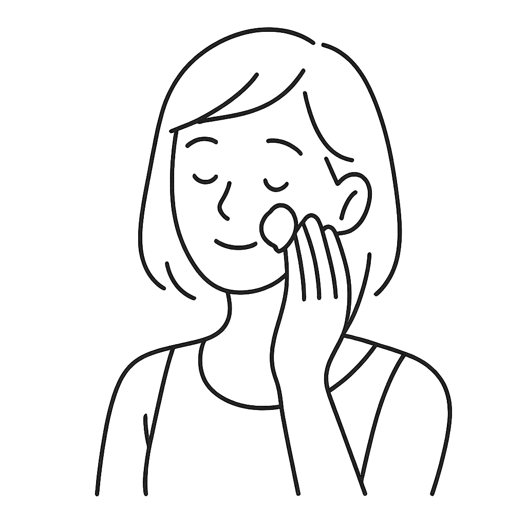 日焼け止めを塗っている女性